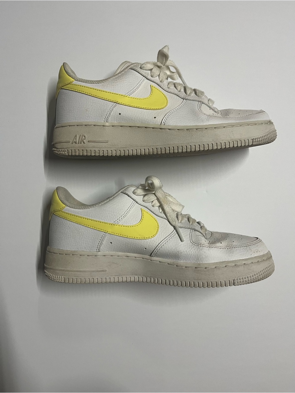 Nike White Low-Top Sneakers with Yellow Swoosh